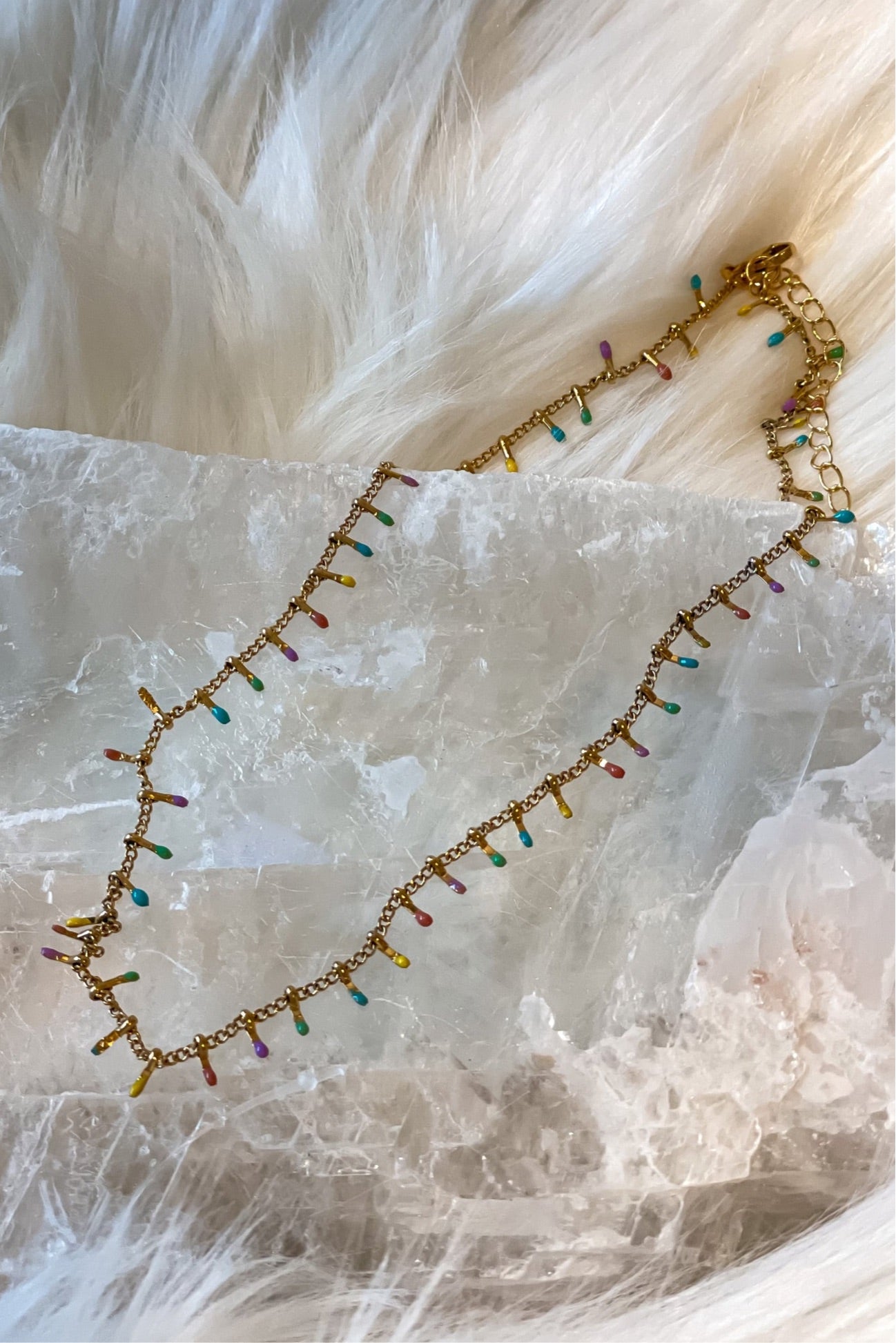 Add some charm to your look with the SS Multi Leaf Choker. This gold choker features multi-colored charms and a lobster claw closure for easy wear. At 7 inches long with a 3 inch extender, it'll fit most neck sizes. Made of stainless steel, you won't have to worry about it turning color or tarnishing.