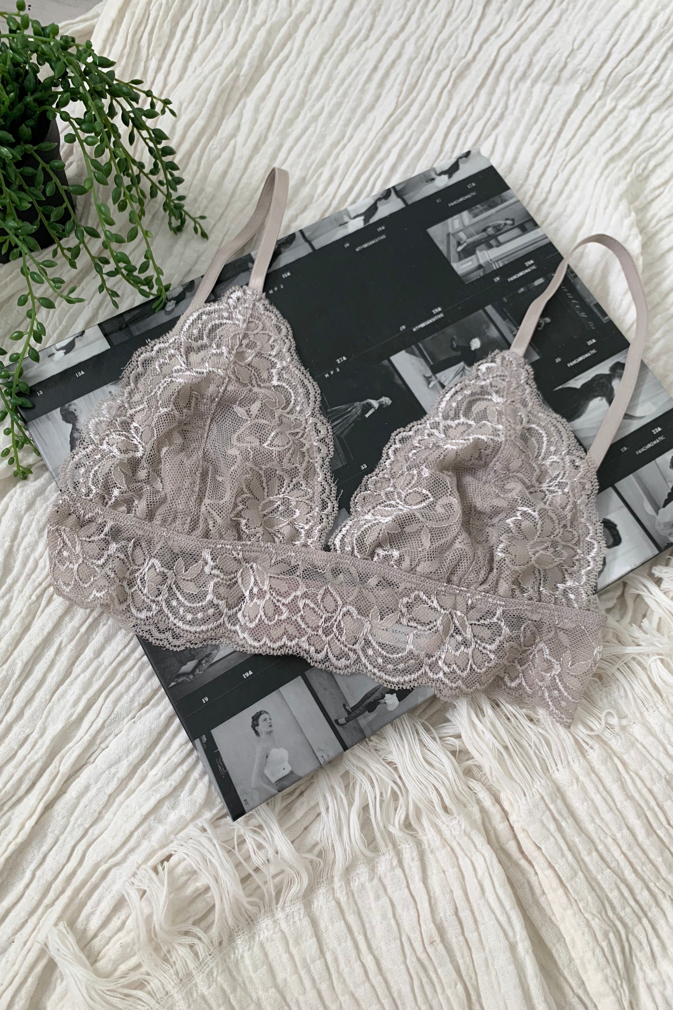 Our second best-selling bralette - wear under a sheer blouse or with a deep plunging v neck dress! Elevate your wardrobe with our BELLA BRALETTE! This soft lace bralette features adjustable shoulder straps and an adjustable back closure for a perfect fit. Wear it under a sheer blouse or with a deep plunging v neck dress - the possibilities are endless! Available in silver, white, and black and runs true to size. Hand wash cold for best results.