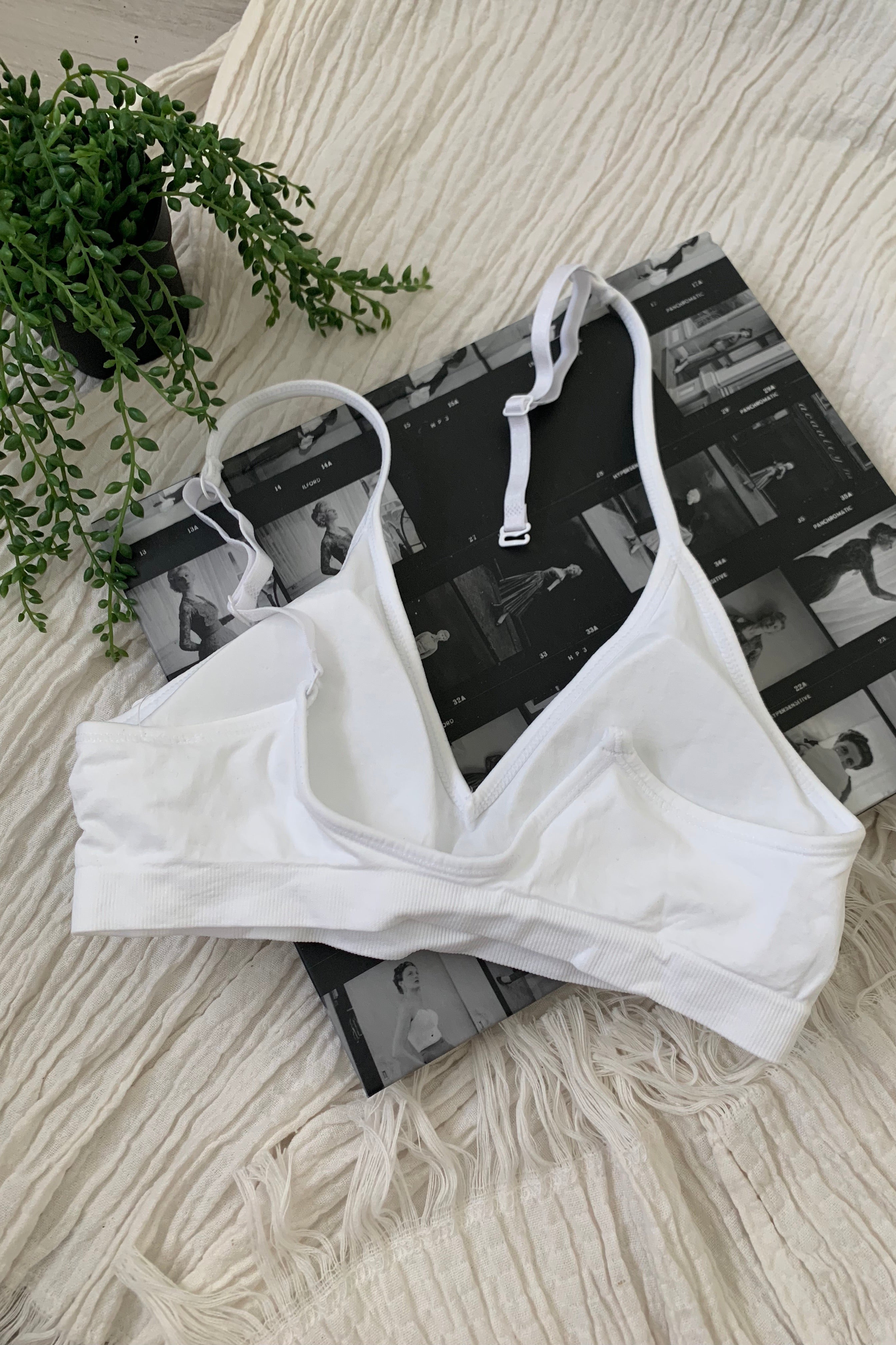 Embrace comfort and style with our CARMELA BRALETTE. Our most popular bralette to date, it features a slip-on design with removable padding and adjustable shoulder straps. Made with soft and stretchy nylon, this one size fits all bralette is perfect for all-day wear. Hand wash cold for best results.