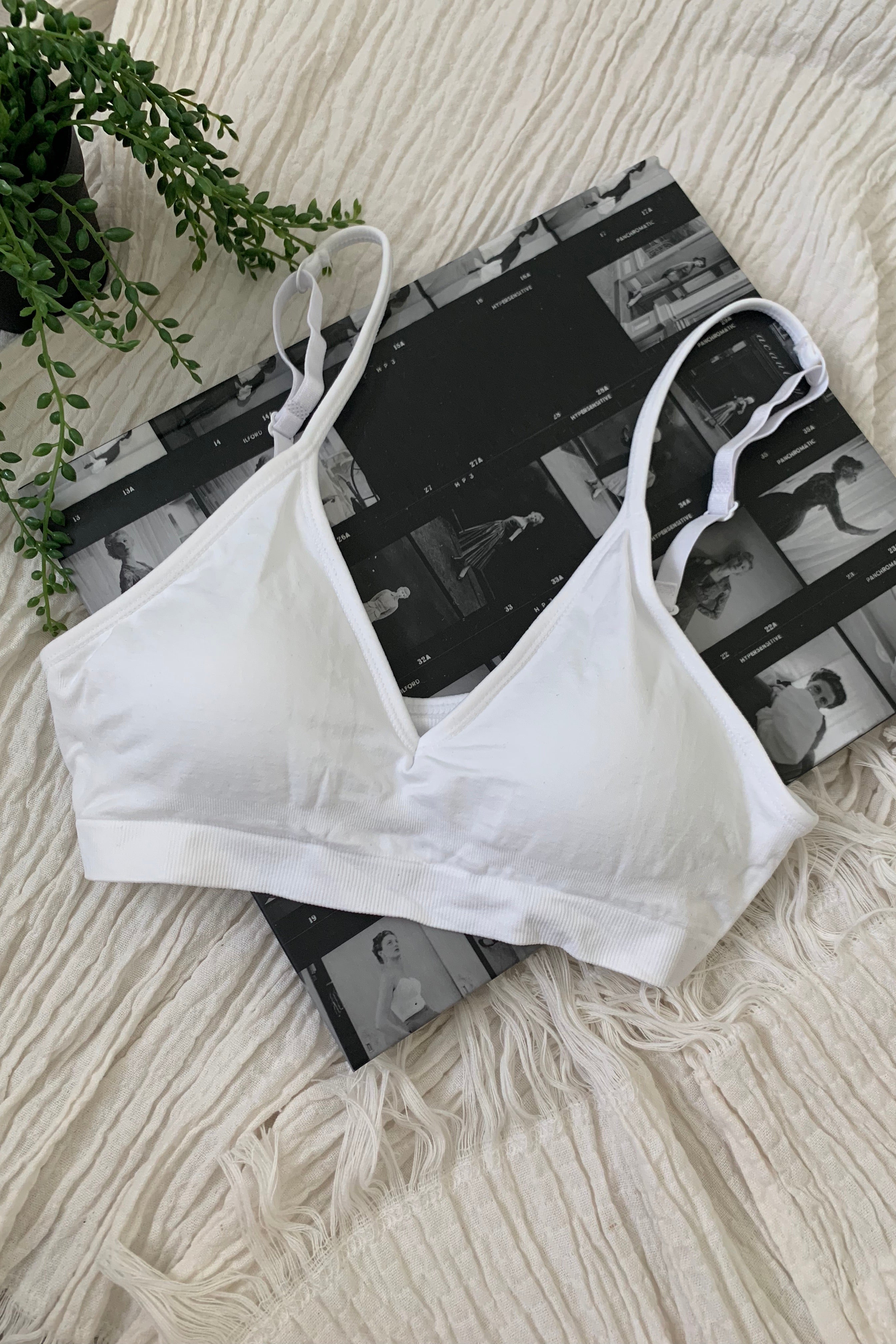 Embrace comfort and style with our CARMELA BRALETTE. Our most popular bralette to date, it features a slip-on design with removable padding and adjustable shoulder straps. Made with soft and stretchy nylon, this one size fits all bralette is perfect for all-day wear. Hand wash cold for best results.