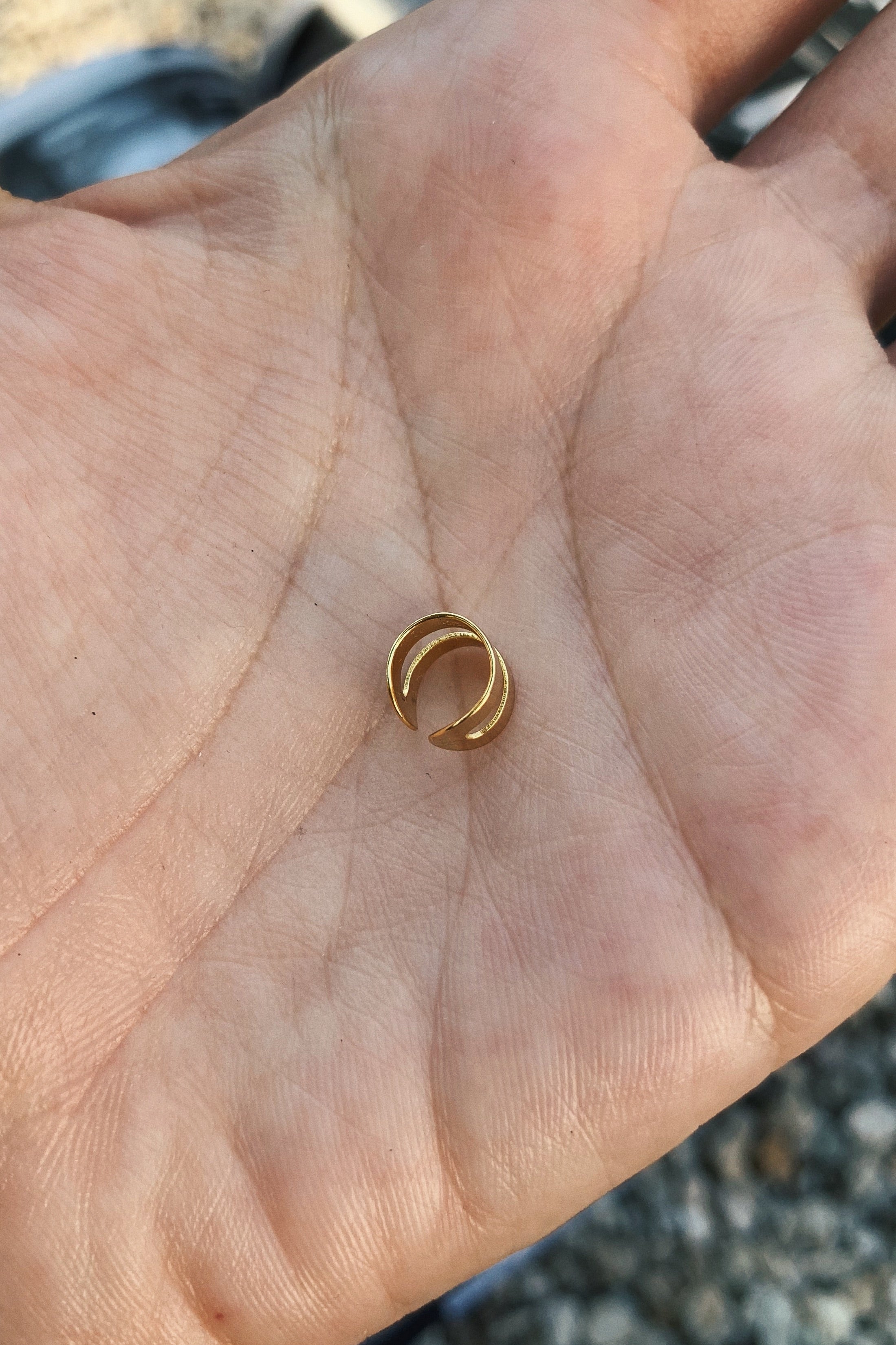 Get the best of both worlds with our DOUBLE EAR CUFF! No piercing necessary, just slip on this gold plated ear cuff for a trendy and edgy look. Say goodbye to the pain of piercings and hello to effortless style!