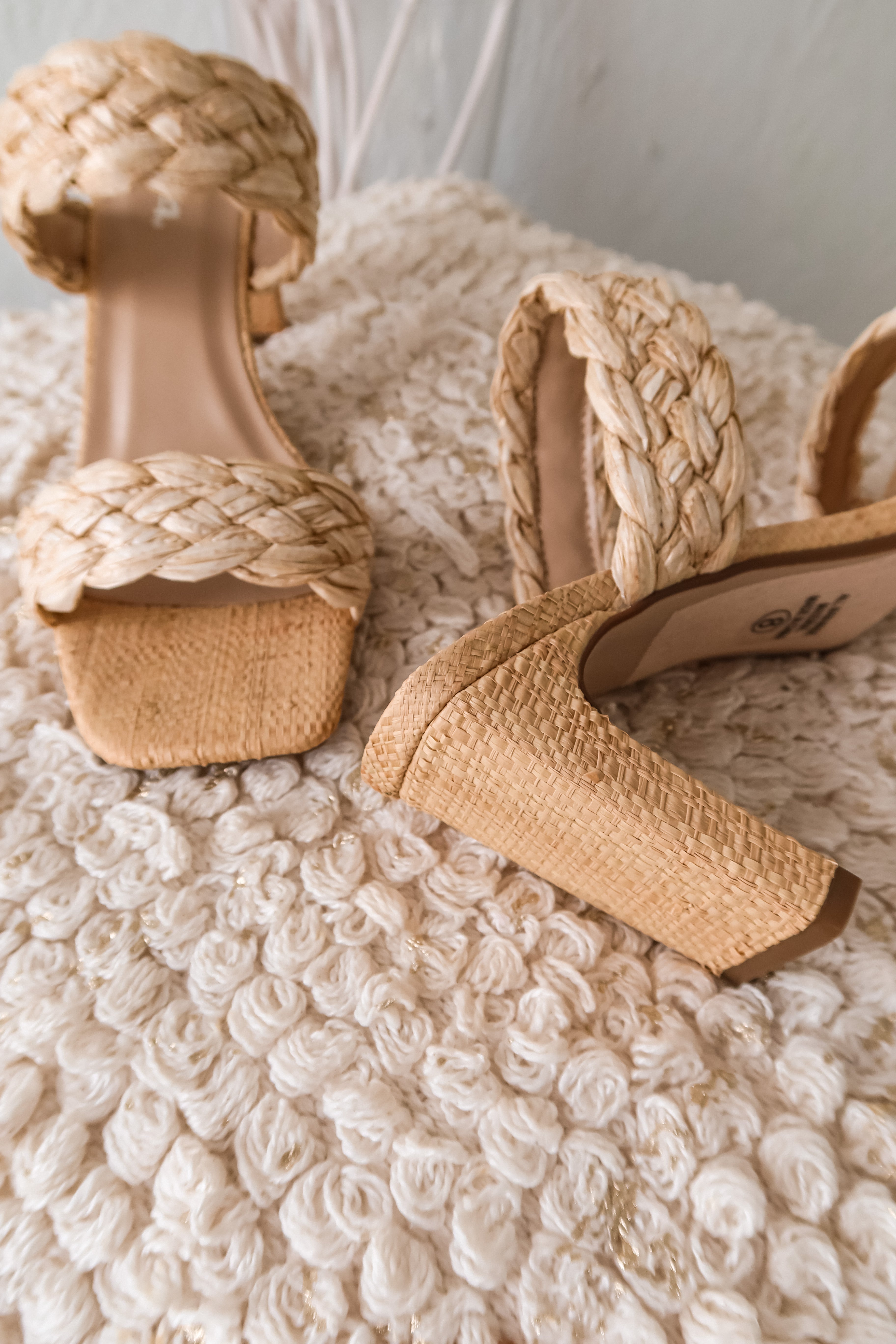 Step up your shoe game with our NATURAL RAFFIA HEEL. Stand tall with a 3 inch heel made from woven raffia straps. Elevate your style and keep it natural with this quirky and playful high heel.