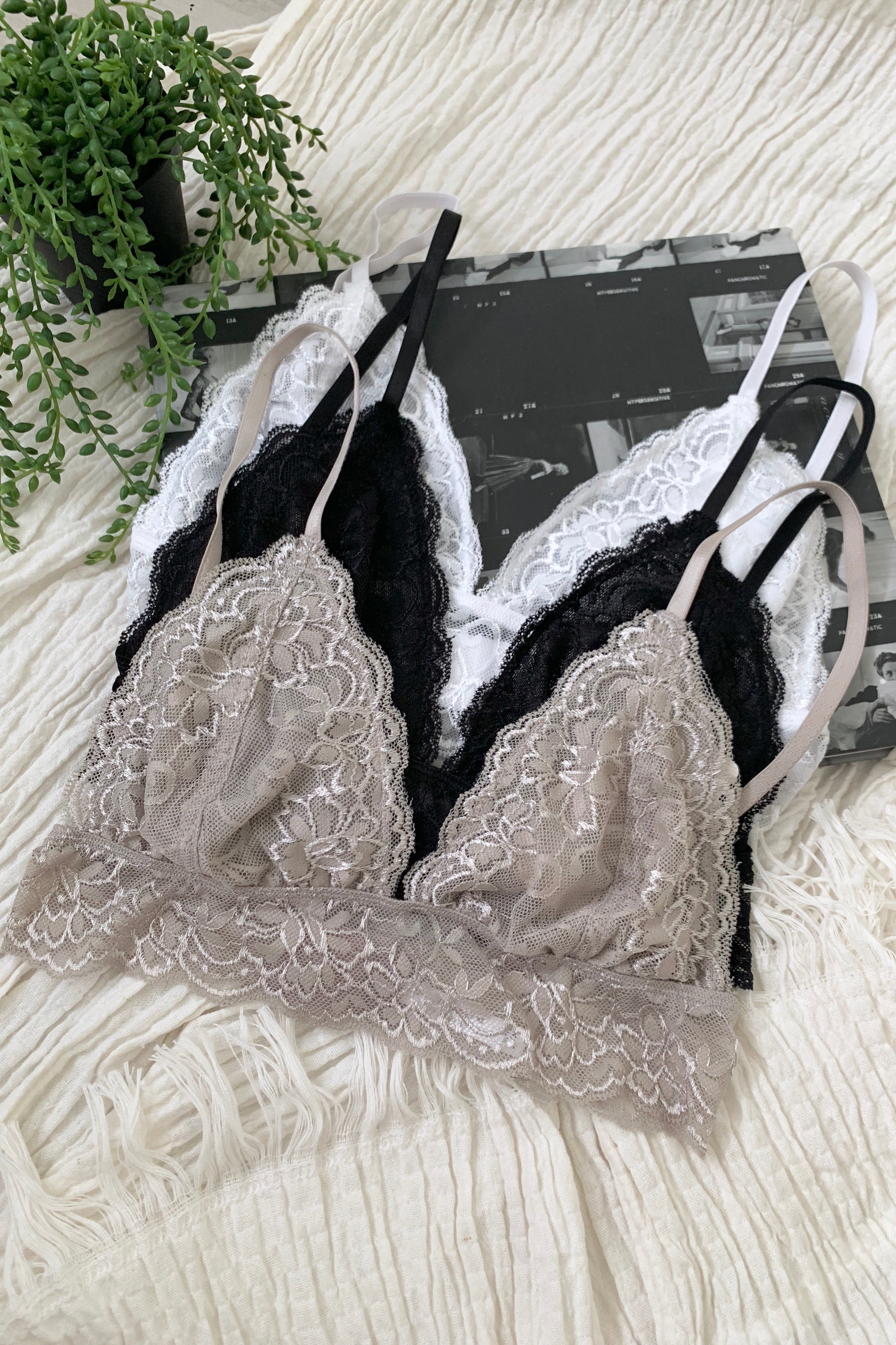 Our second best-selling bralette - wear under a sheer blouse or with a deep plunging v neck dress! Elevate your wardrobe with our BELLA BRALETTE! This soft lace bralette features adjustable shoulder straps and an adjustable back closure for a perfect fit. Wear it under a sheer blouse or with a deep plunging v neck dress - the possibilities are endless! Available in silver, white, and black and runs true to size. Hand wash cold for best results.