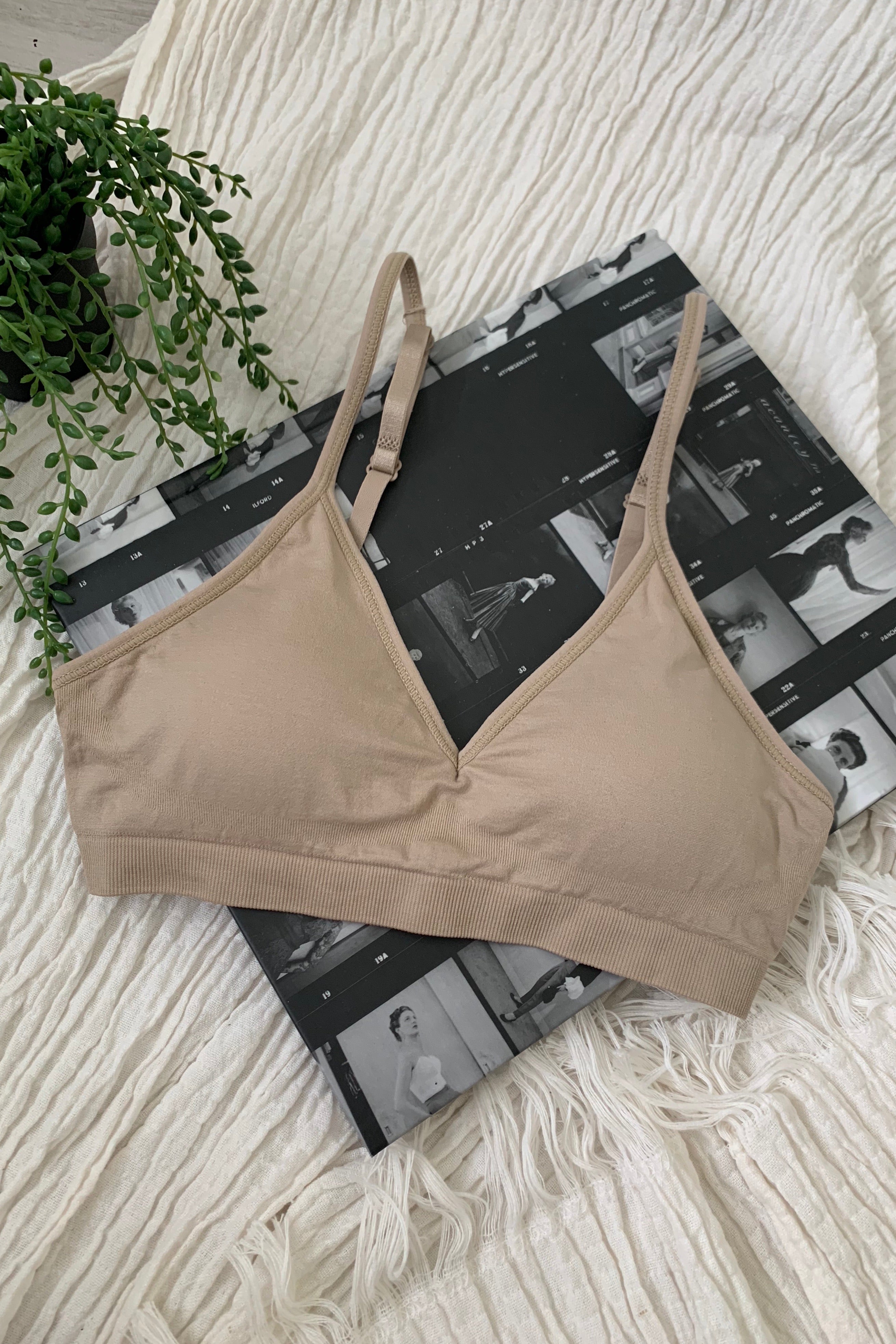 Embrace comfort and style with our CARMELA BRALETTE. Our most popular bralette to date, it features a slip-on design with removable padding and adjustable shoulder straps. Made with soft and stretchy nylon, this one size fits all bralette is perfect for all-day wear. Hand wash cold for best results.