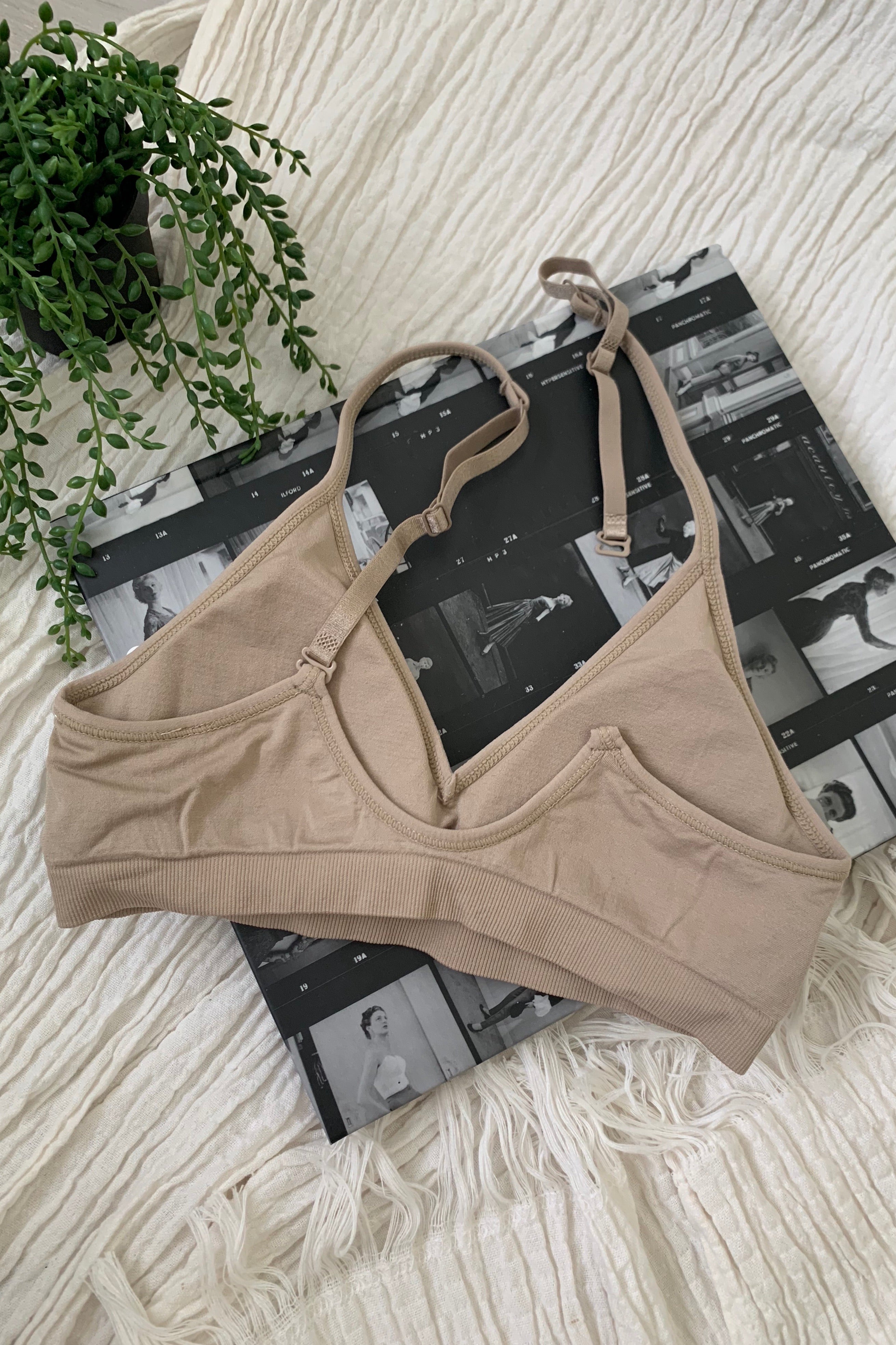 Embrace comfort and style with our CARMELA BRALETTE. Our most popular bralette to date, it features a slip-on design with removable padding and adjustable shoulder straps. Made with soft and stretchy nylon, this one size fits all bralette is perfect for all-day wear. Hand wash cold for best results.