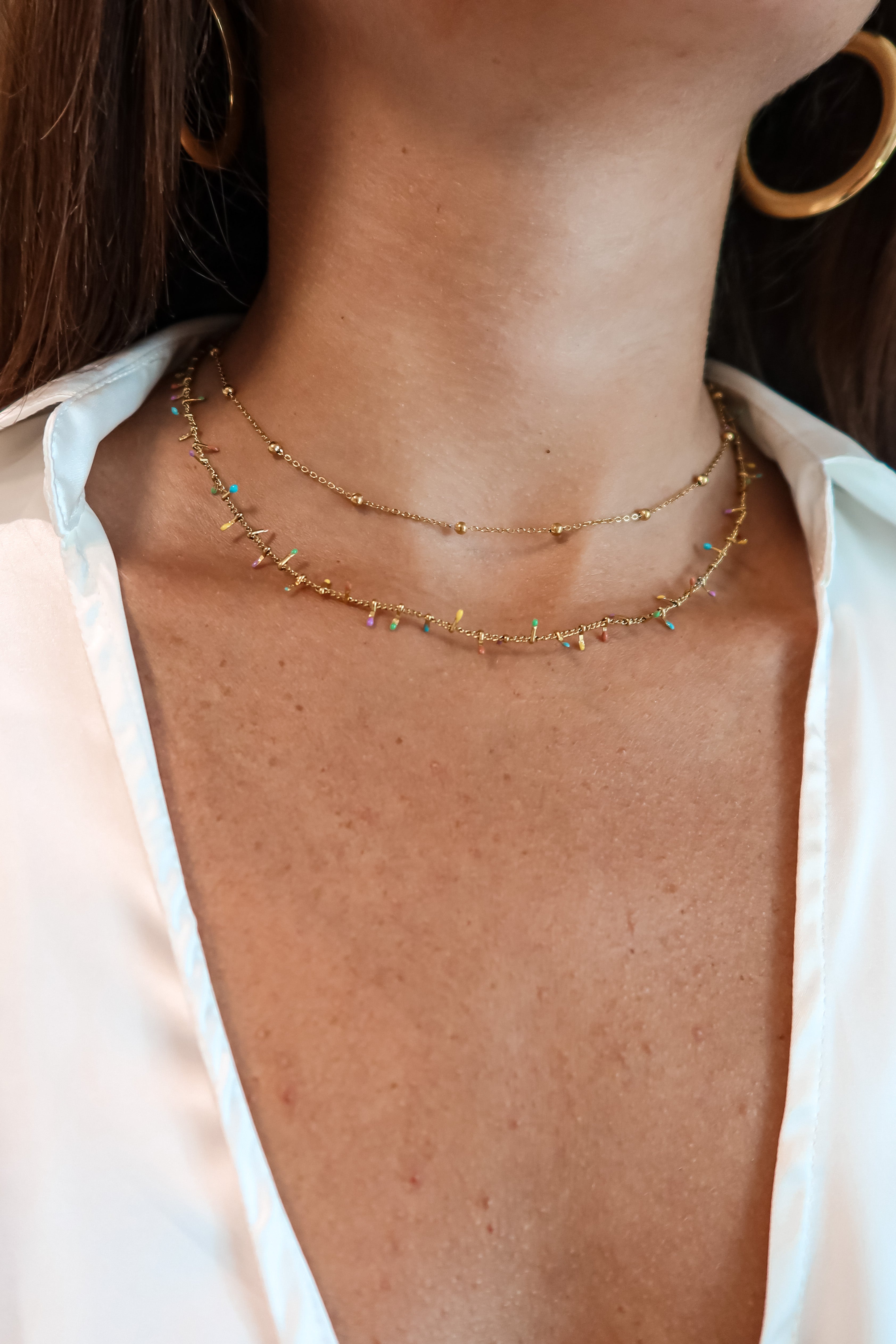 Add some charm to your look with the SS Multi Leaf Choker. This gold choker features multi-colored charms and a lobster claw closure for easy wear. At 7 inches long with a 3 inch extender, it'll fit most neck sizes. Made of stainless steel, you won't have to worry about it turning color or tarnishing.